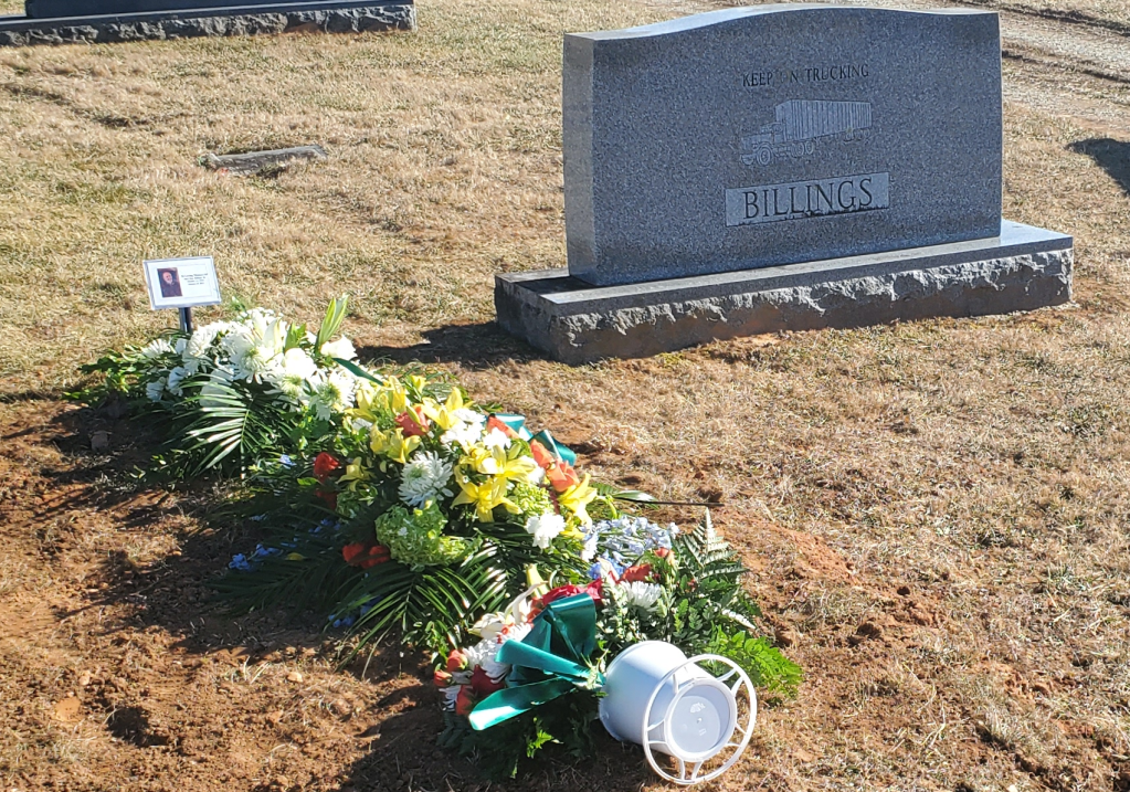 My dad's grave site. The family tombstone reads "Keep on trucking."